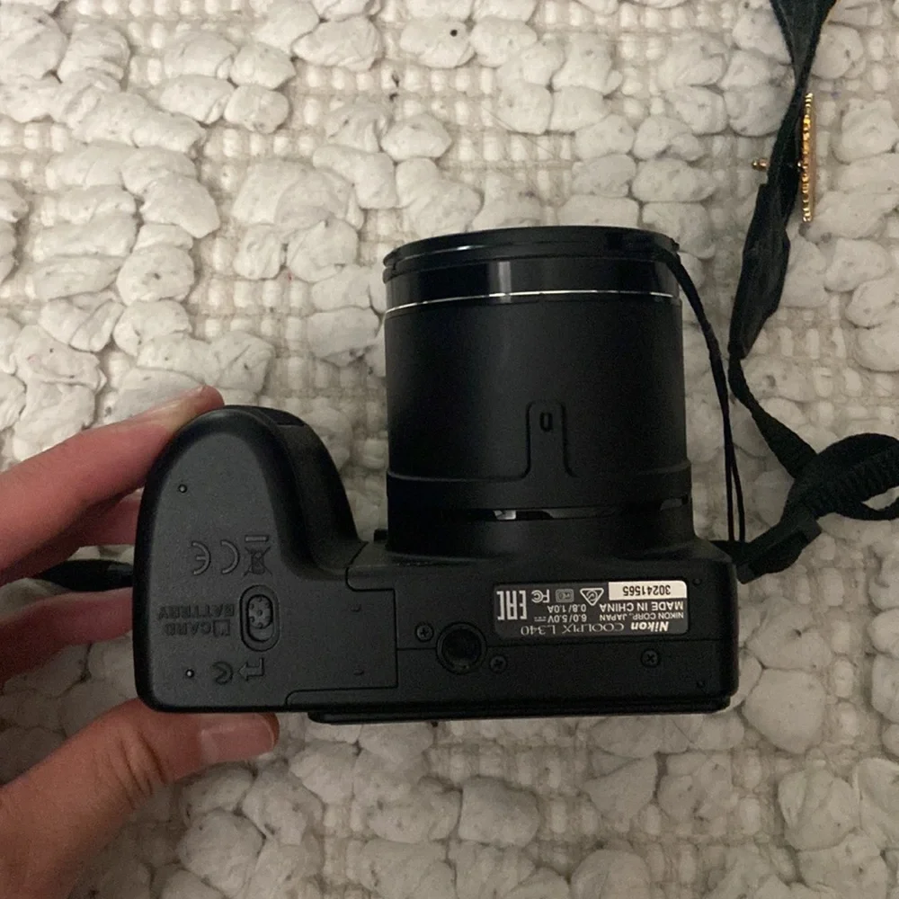 Black Nikon coolpix digital camera